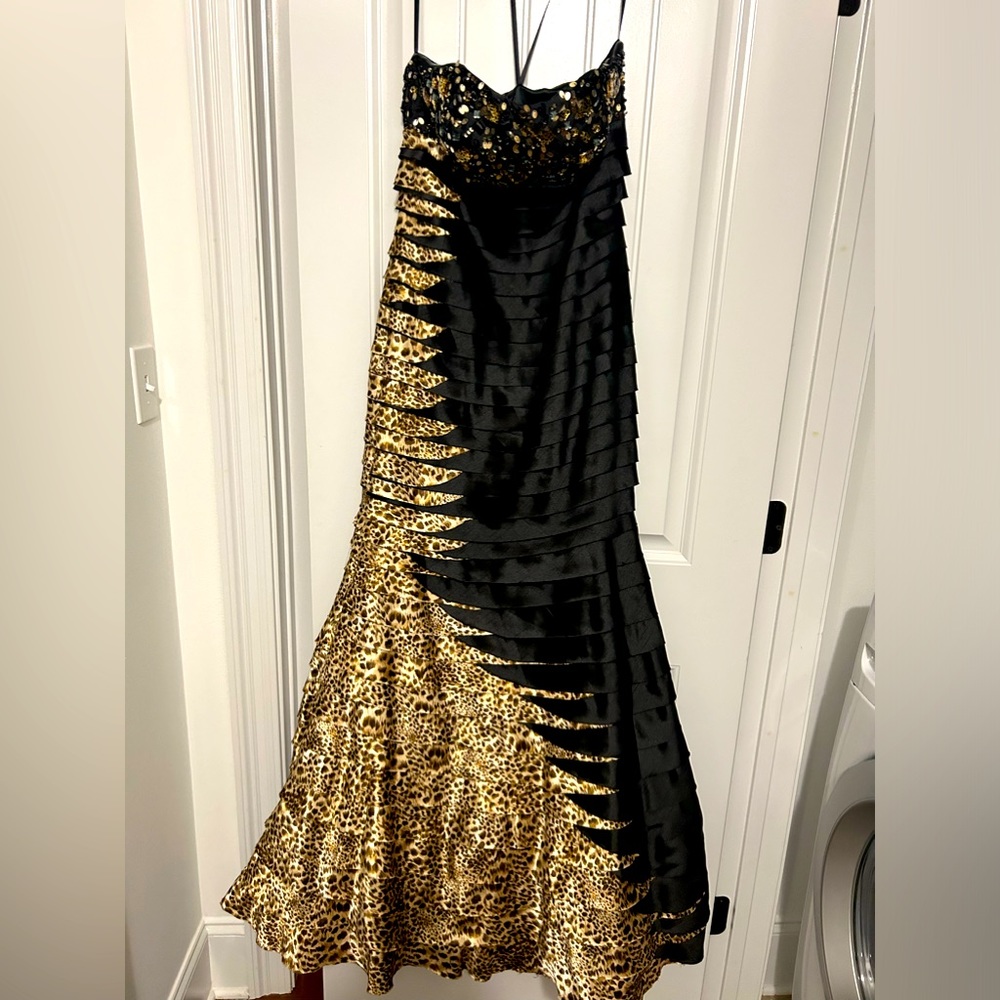 Black and gold formal sleeveless long dress with animal print.